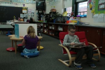 picture First-grade students at Wyland Elementary School complete classroom assignments in the seating of their choice.