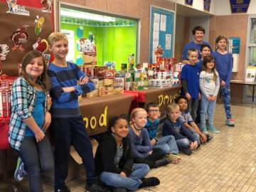 Students at Broad Street Elementary School in the Mechanicsburg Area SD collect food for Operation Wildcat’s Project Thanksgiving, which supplies baskets of food to local families in need at the holiday.