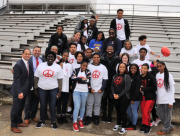 PWHS Principal Dr. Jason Bacani and Assistant Principal Maico Azcona (on left) join members of the Black Cultural Awareness Club with Philadelphia Eagle Torrey Smith (center).
